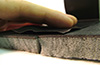 Foam absorption with a barrier layer